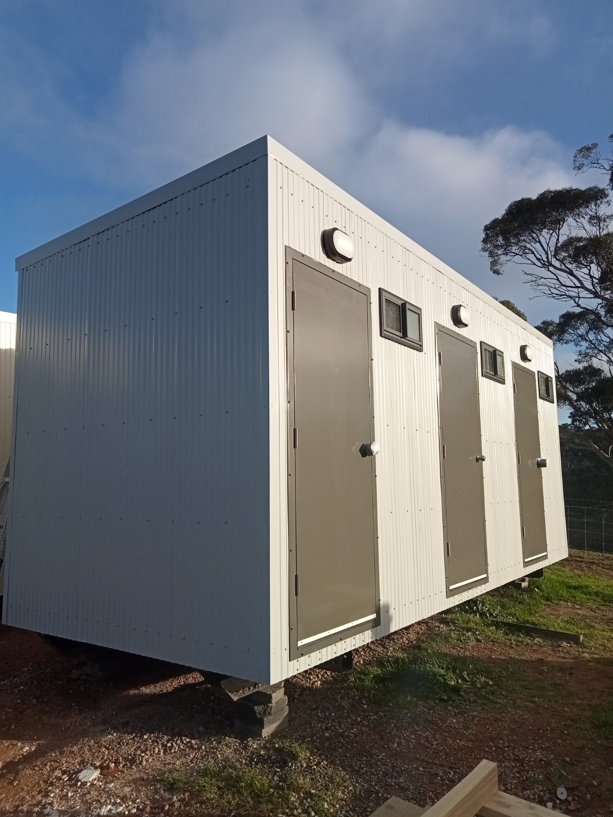 portable toilet blocks being delivered by Out-Back Portable Buildings